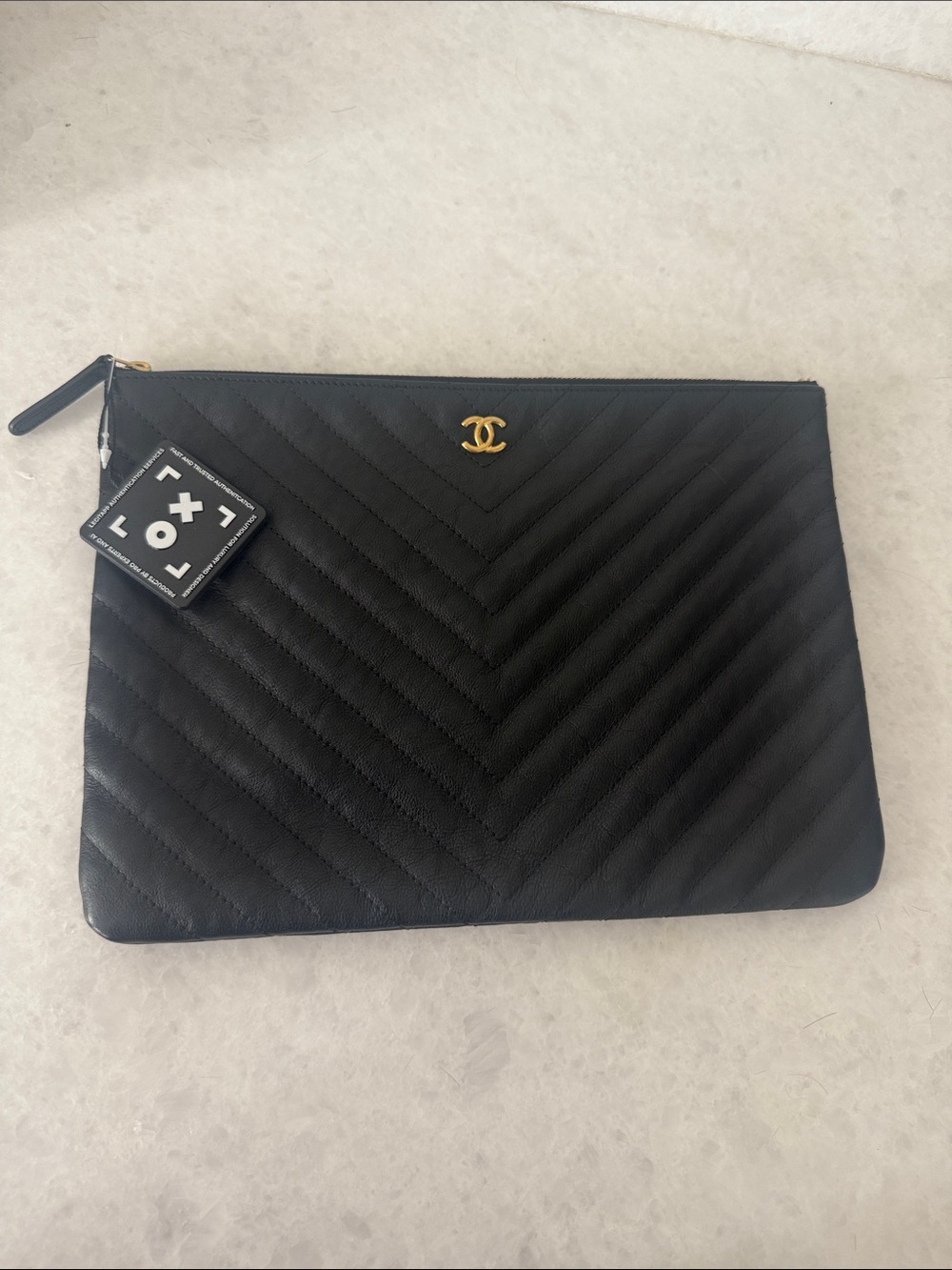 CHANEL Black Chevron Quilted Leather Zip Pouch with Gold CC